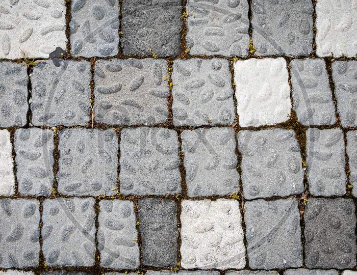 The Road Is Paved With Gray Stones, Top View. Stone Texture, Outdoor Stone Tiles