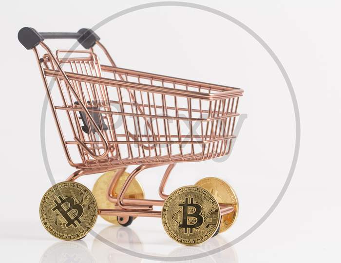 Copper Shopping Cart With Bitcoins, Top Angle Stock Photo