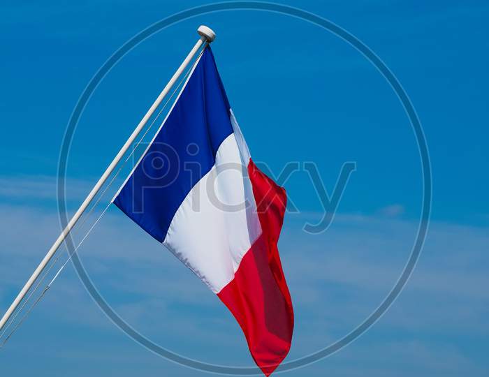 French Flag Of France Over Blue Sky