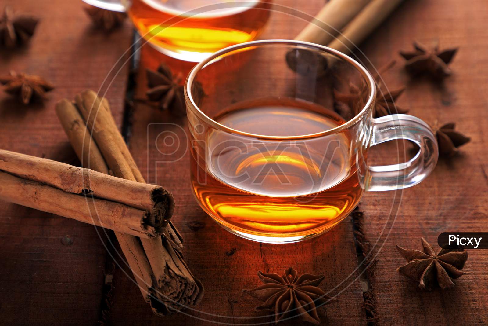 Healthy Herbal Tea With Star Anise And Cinnamon In A Cup On Wooden Table