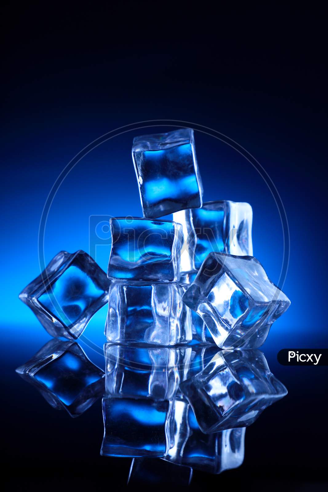 Ice Cubes Stacked Up On Blue Background