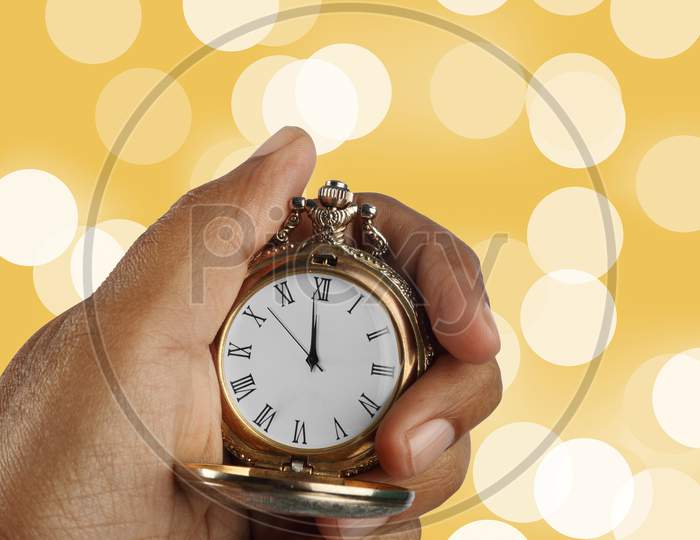 New Year Countdown Concept Golden Antique Watch In A Hand