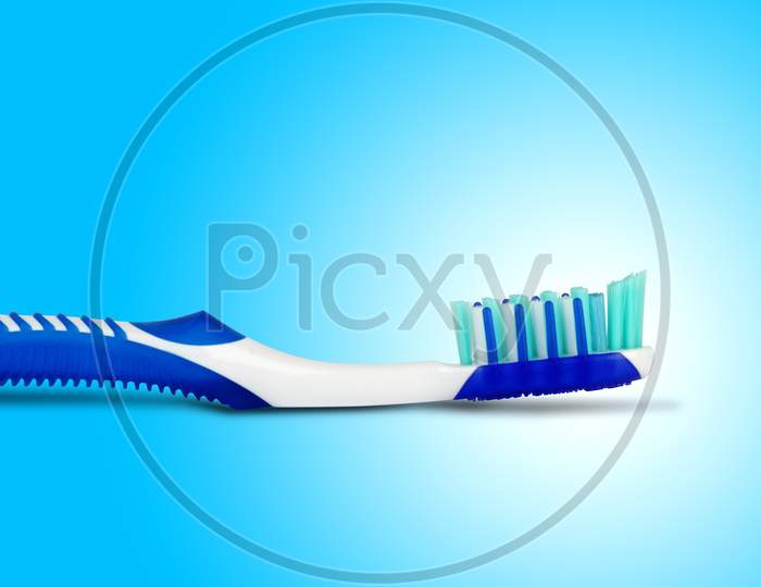 Tooth Brush In Blue Background