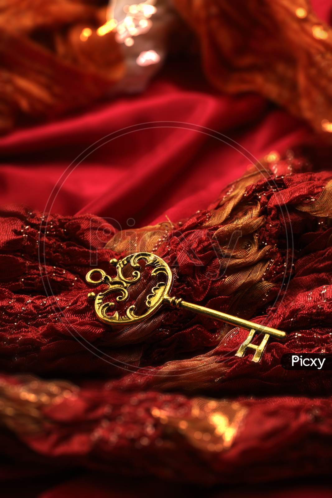 Antique Golden Key On Red Fabric Background
