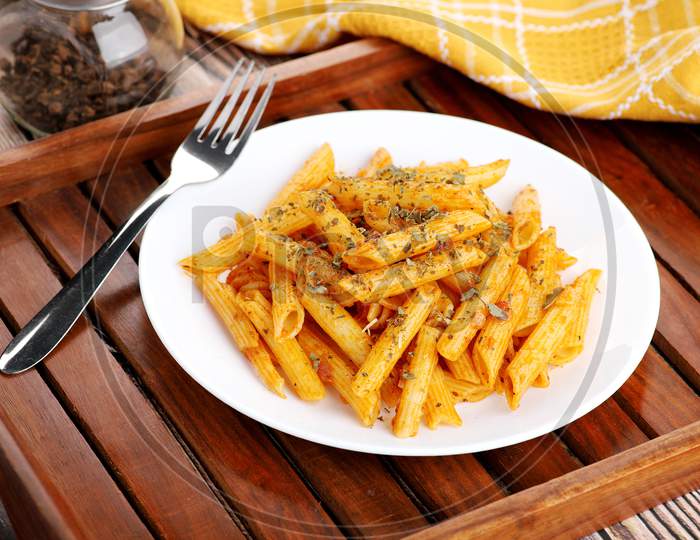Food - Tasty Penne Pasta Plate With A Fork On Wooden Tray