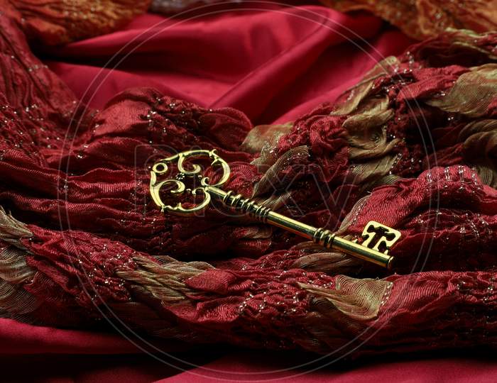 Golden Vintage Luxury Key On Red Royal Fabric