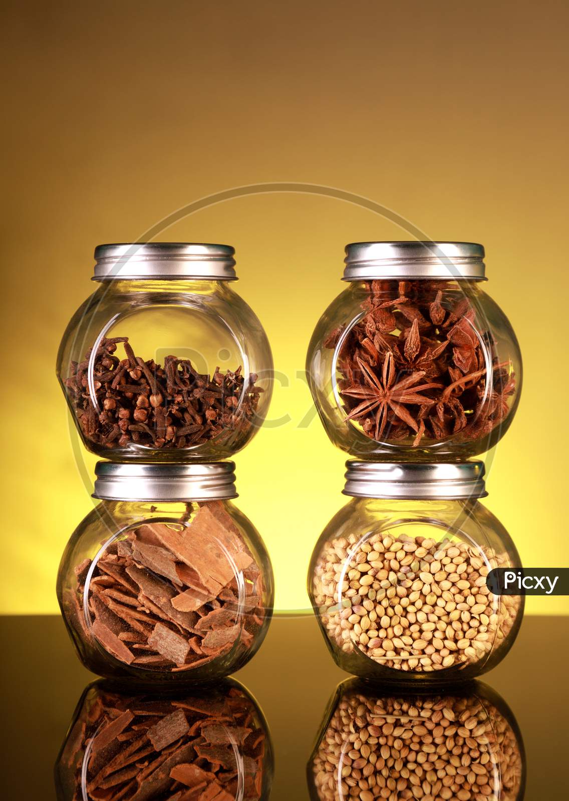 Spice Jars With Star Anise, Cloves, Cinnamon, Coriander Seeds