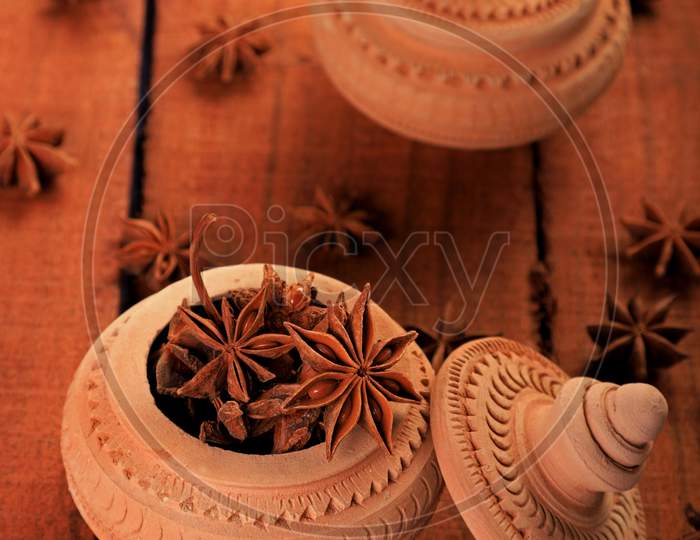 Indian Spice Star Anise In A Handmade Pottery Container