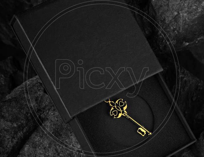 Antique Golden Key In An Open Black Box