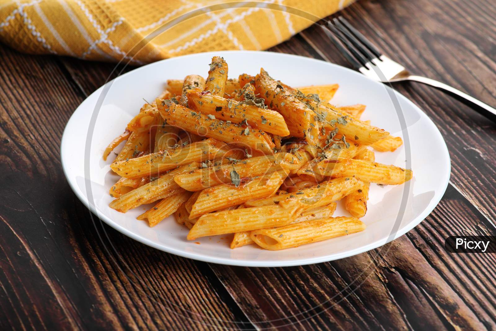 Food - Tasty Penne Pasta Plate With A Fork On Wooden Table