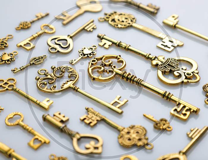Beautiful Antique Golden Keys On White Background