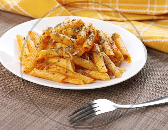 Penne Pasta Food Plate With A Fork On Wooden Tray