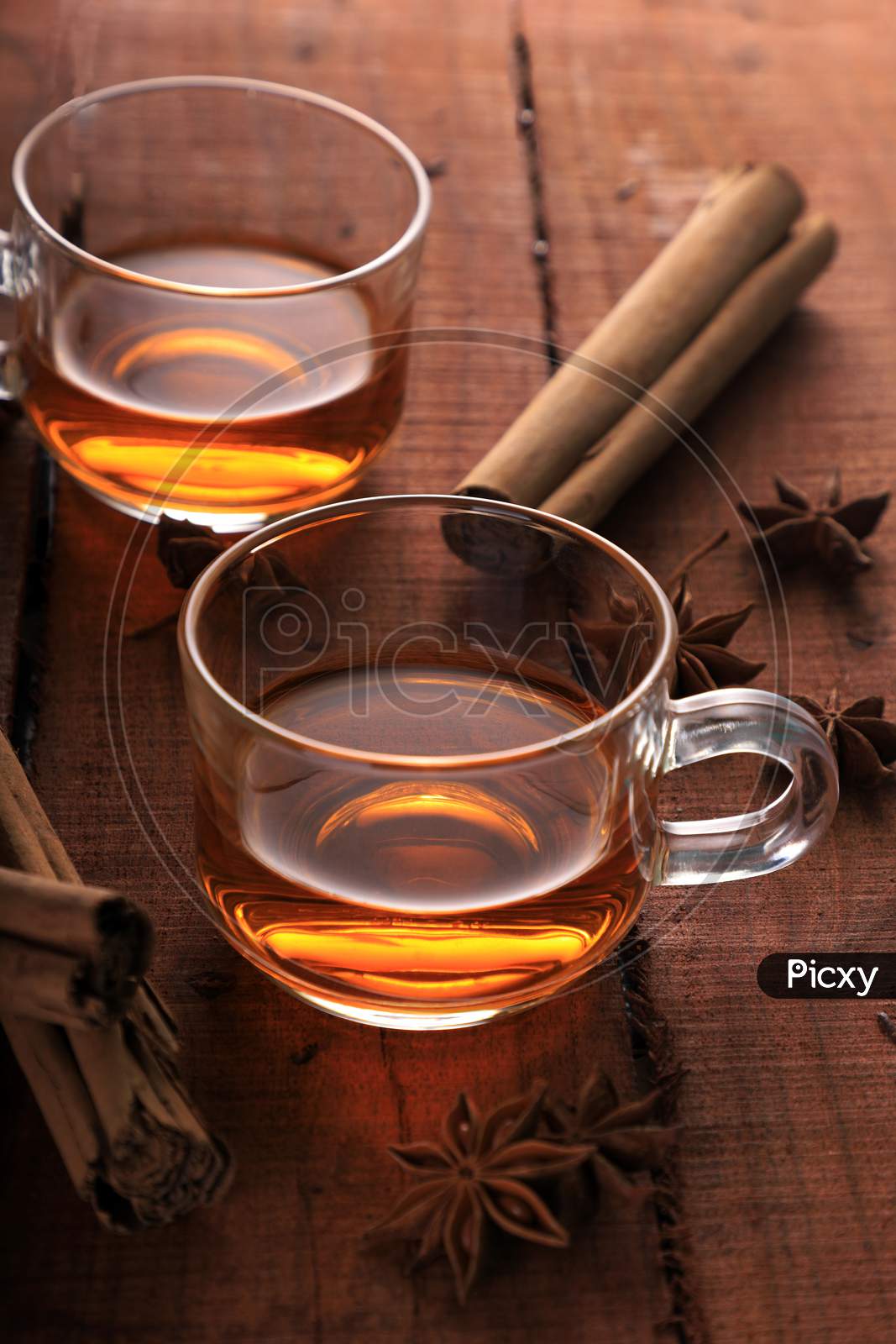 Herbal Tea With Star Anise And Cinnamon In A Cup On Wooden Table