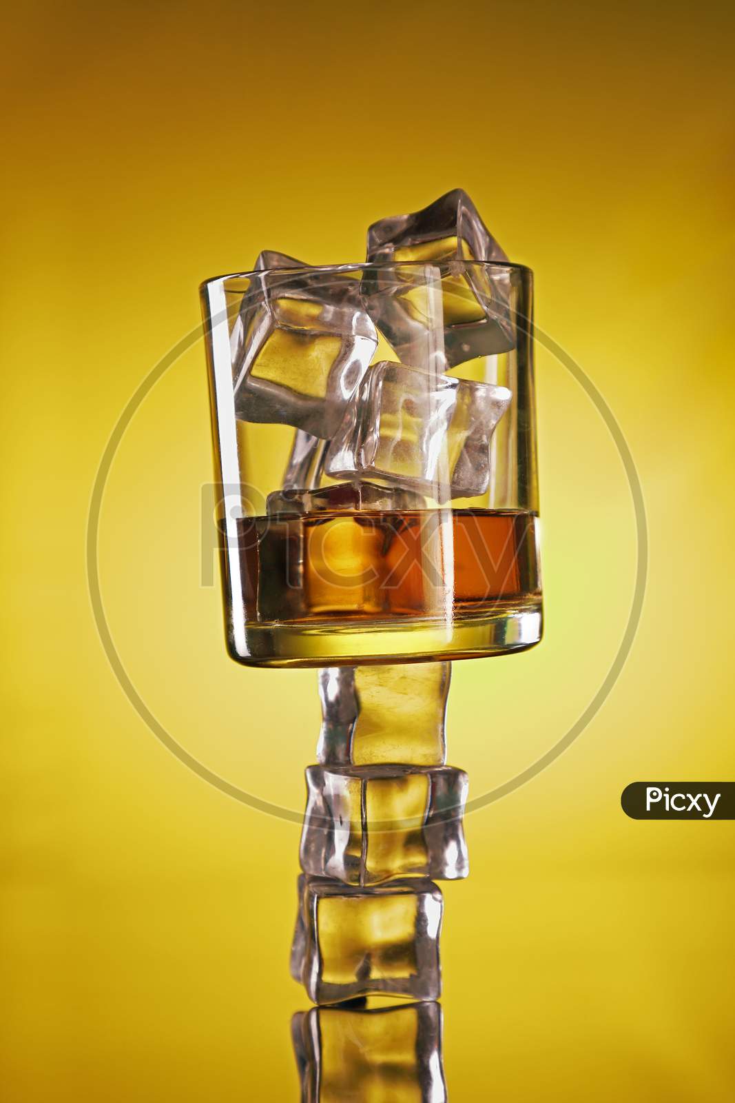 Chilled Whisky Glass On Ice Cubes Creative Shot