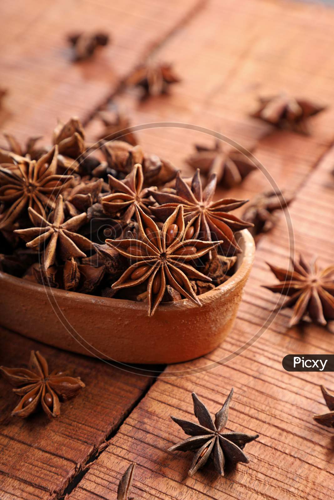 Organic Indian Spice / Herb Star Anise In A Brown Bowl