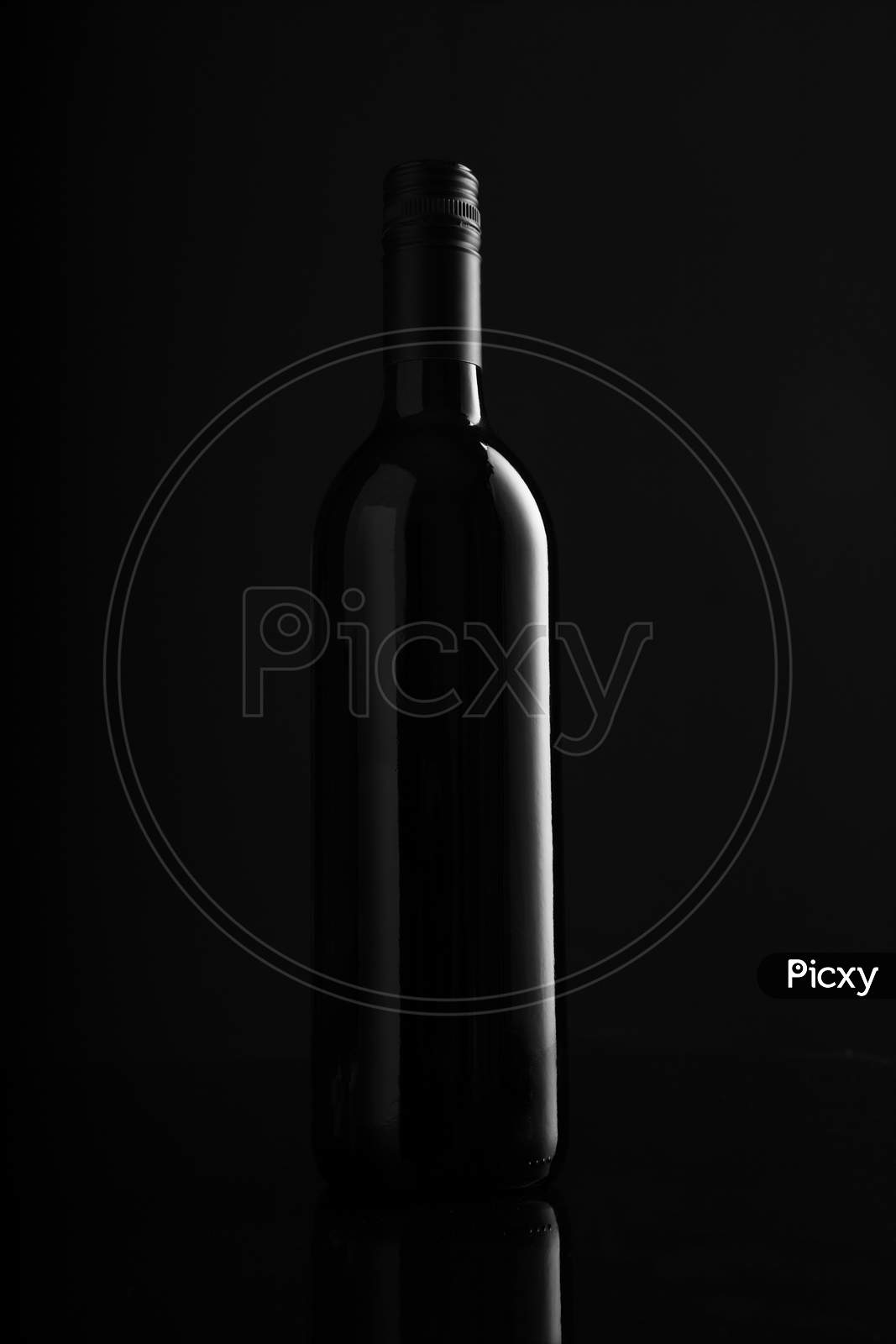 Red Wine Bottle On Black Background