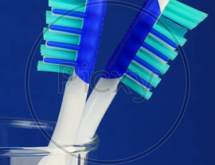 Two Tooth Brush In Blue Background