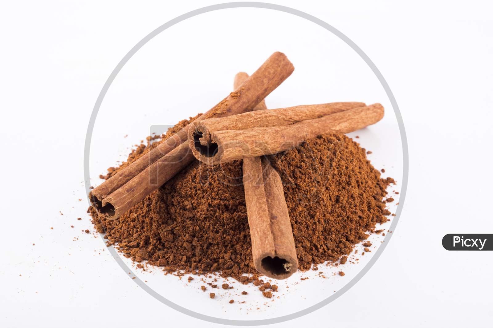 Cinnamon Sticks And Powder, White Background Stock Photo