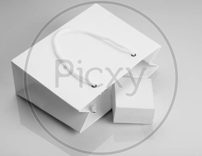 White Paper Shopping Bag And Jewelry Box For Mockups