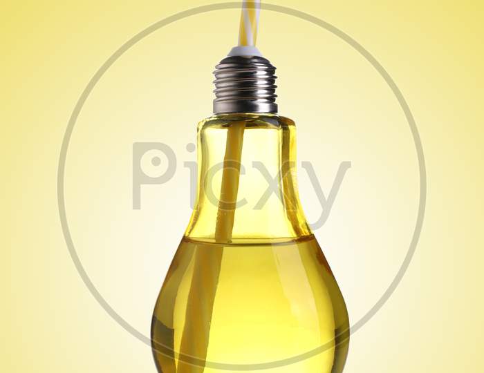 Yellow Colored Bulb Shaped Drinking Glass With Straw
