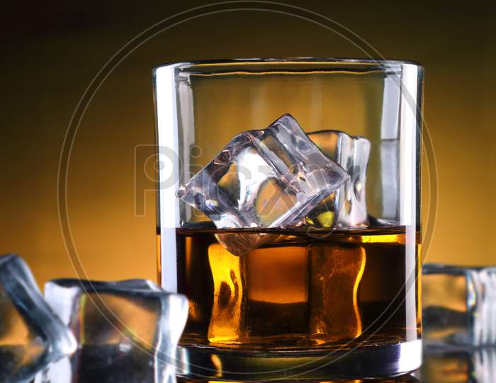 A Whisky Glass  With Ice Cubes