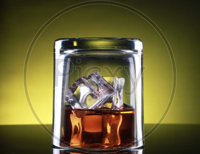 Whisky Glass Upside Down With Ice Cubes
