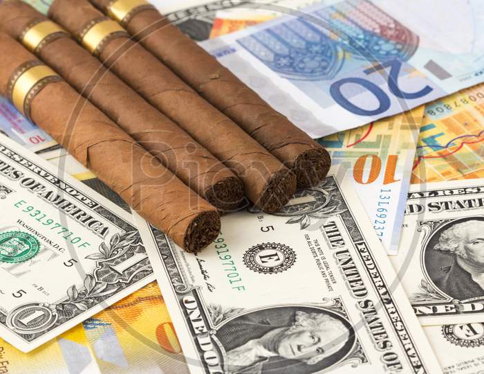 Smoking Cost Concept. Cigarettes In Euros And Dollers  Background. 3D Illustration Stock Photo