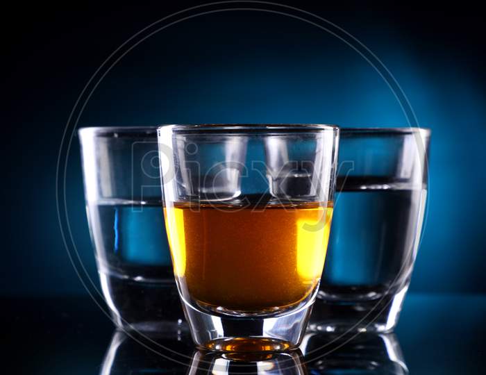Three Shot Glasses With Alcohol Drinks