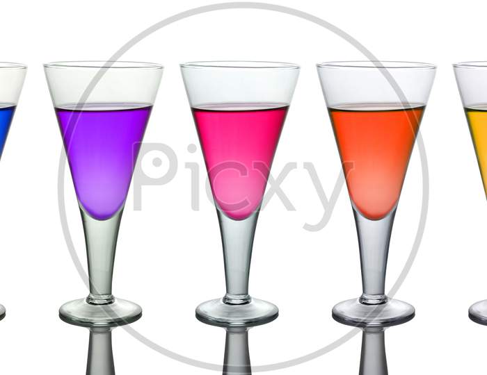 Seven Different Colored Wine Glasses Isolated On White Background