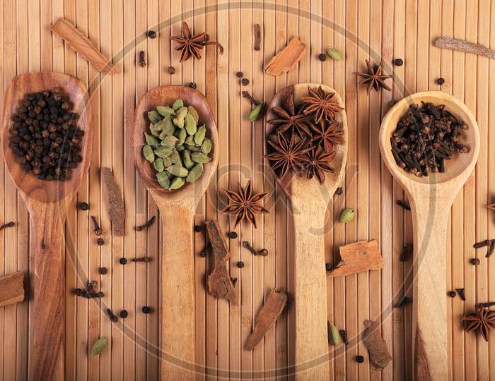 Indian Spices In Wooden Spoons / Spatula