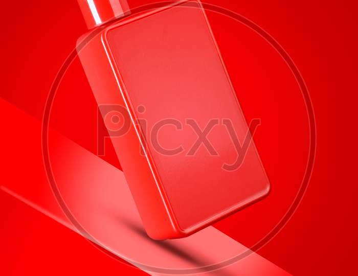 Red Colored Sanitizer / Shampoo / Shower Gel Bottle Mockup On Red Background