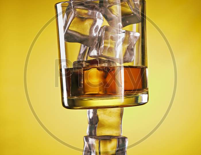 Chilled Whisky Glass On Ice Cubes Creative Shot