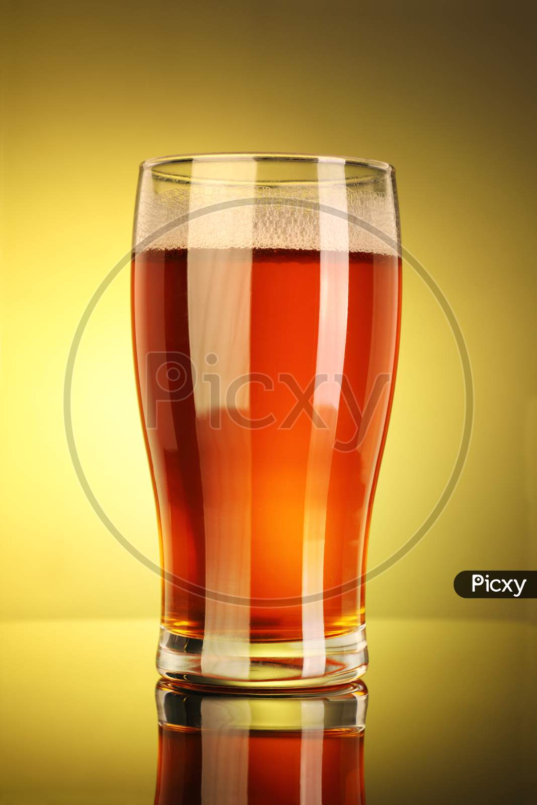 Full Beer Glass With Yellow Background