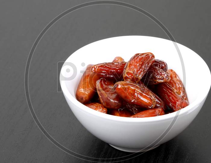 Fresh Dates In A White Bowl