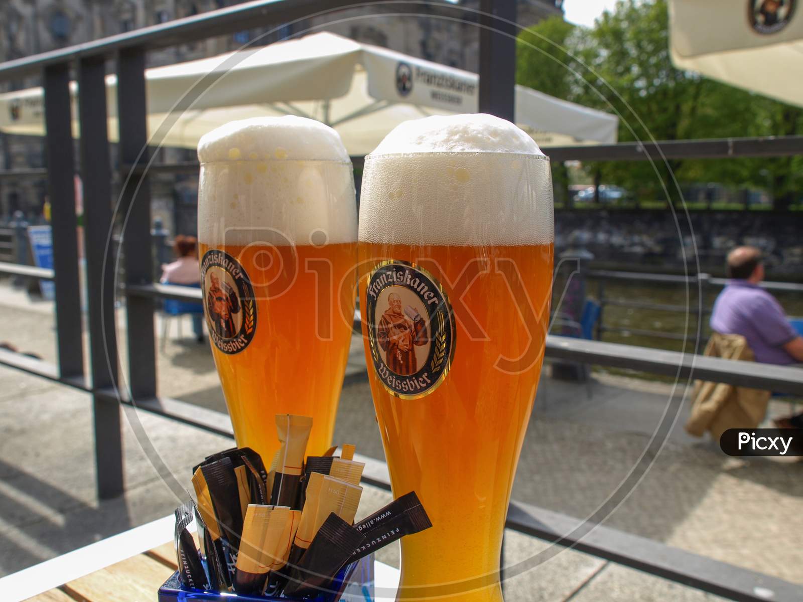 Berlin, Germany - April 24, 2010: Glasses Of German Franziskaner Weiss Beer At A Bar On River Spree Bank On April 24, 2010 In Berlin, Germany