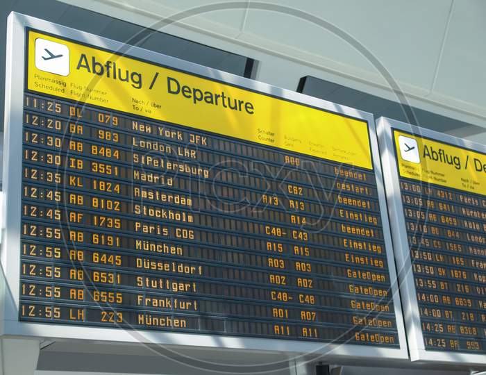 Berlin, Germany - April 26, 2010: Flight Departures Timetable In Berlin Airport Showing International And National Flights