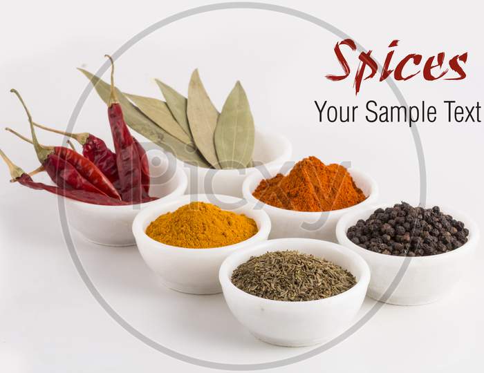 Collection Of Different Spices In Ceramic Bowls And Herbs Isolated On White Stock Photo