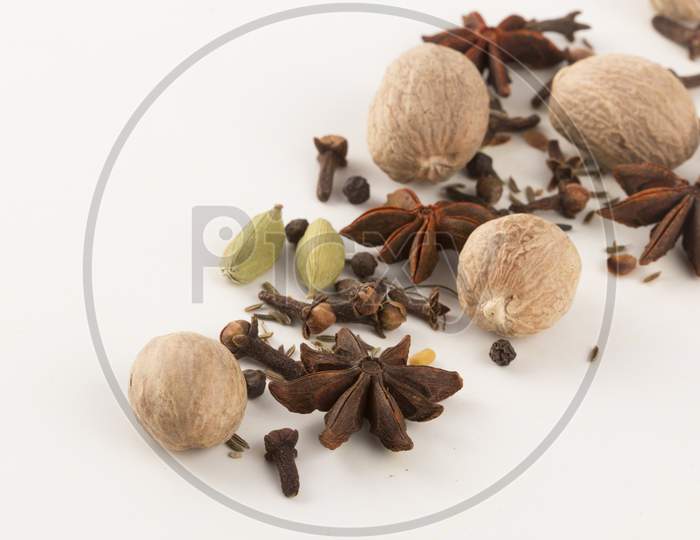 Spices: Cinnamon And Anise Stars, Cloves, Nutmegs And Cardamom Stock Photo