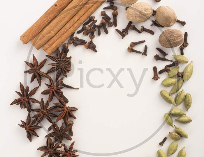 Spices: Cinnamon And Anise Stars Cloves, Cardamom And Nutmegs Stock Photo