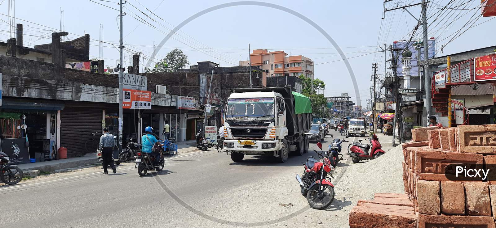 Vehicles are moving in Bongaigaon Township Highway near Paglasthan