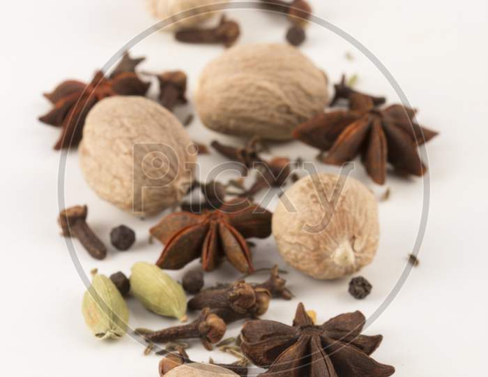 Spices: Cinnamon And Anise Stars, Cloves, Nutmegs And Cardamom Stock Photo