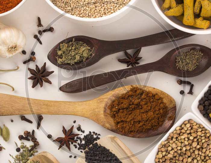 Wooden Spoon With Mixed Spices Top View Stock Photo