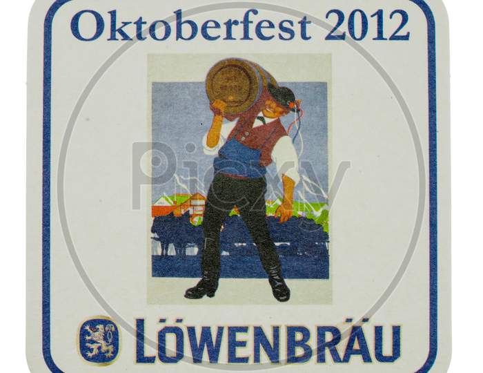 Berlin, Germany - March 15, 2015: Beermat Of German Beer Loewenbraeu Isolated Over White Background