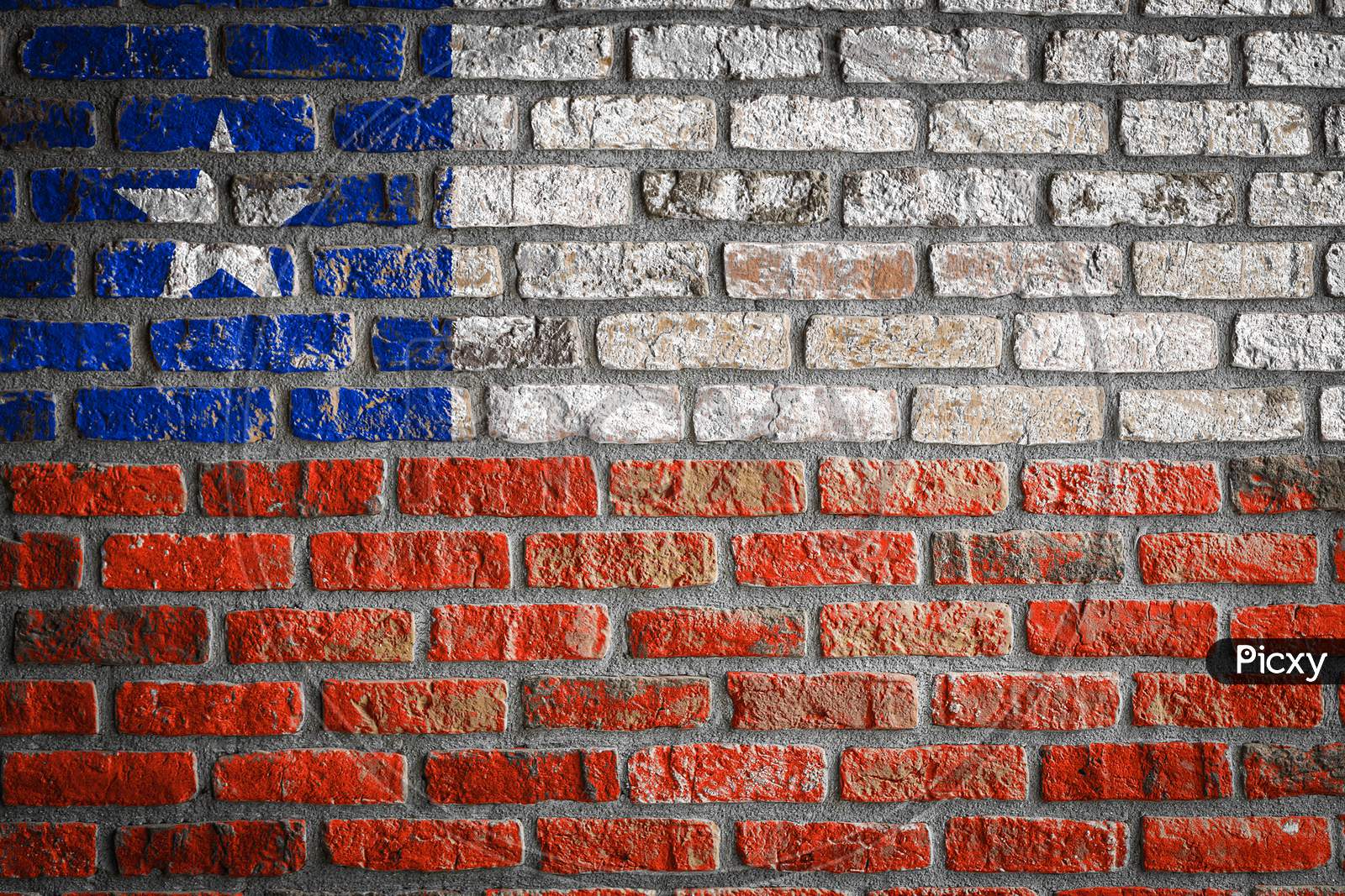 National Flag Of Chile
 Depicting In Paint Colors On An Old Brick Wall. Flag  Banner On Brick Wall Background.