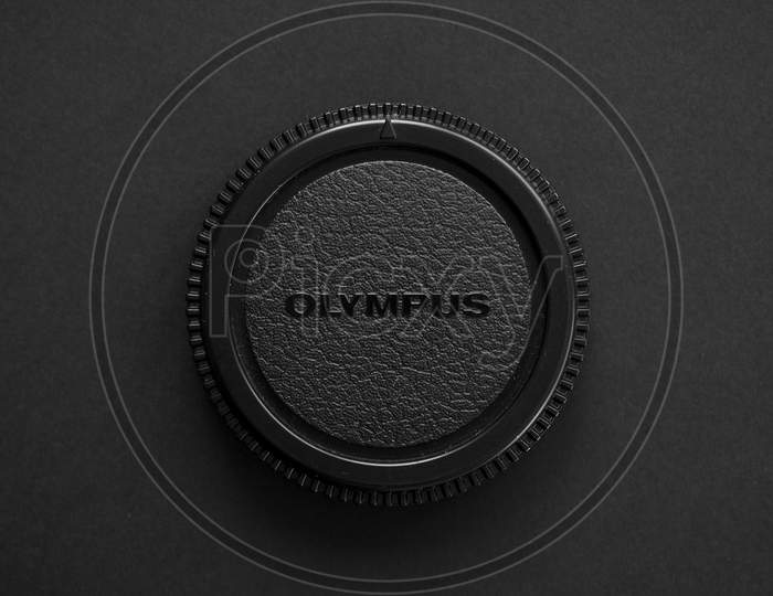 Olympus Logo On Lens Cap With Copy Space In Tokyo, Japan