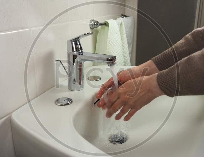 Unrecognisable Man Washing Hands