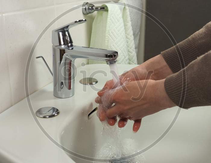 Unrecognisable Man Washing Hands
