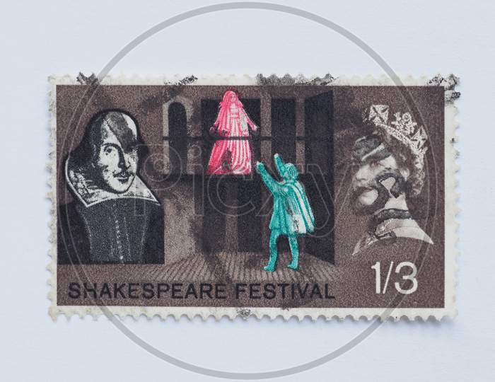 London, Uk - August 15, 2015: A Stamp Printed By United Kingdom Shows Poet William Shakespeare And Her Majesty The Queen Elizabeth Ii