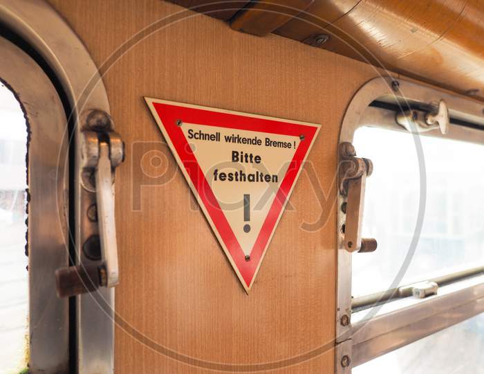 Quick-Acting Brake, Please Hold Sign On German Tram