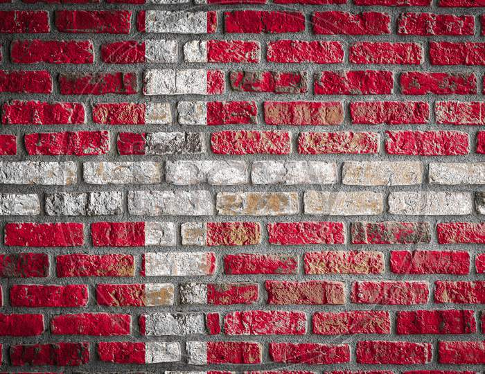 National Flag Of Denmark Depicting In Paint Colors On An Old Brick Wall. Flag  Banner On Brick Wall Background.